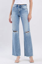 Light Wash Distressed Denim + Raw Hem