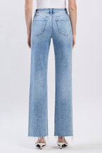 Light Wash Distressed Denim + Raw Hem